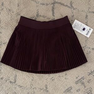Lululemon maroon sz 4 pleated tennis skirt , NWT, with athletic shorts under